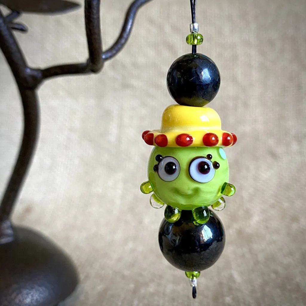 Hangable Shungite Accessory, Lime Green Squeedle in Yellow Hat